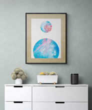 Load image into Gallery viewer, Art print of underwater scene with jellyfish by Grace Marquez titled "Bubble: Tentacles Reaching" displayed on the wall above a contemporary white dresser