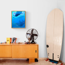 Load image into Gallery viewer, Painting on wall above chest, a retro fan and surfboard against the wall