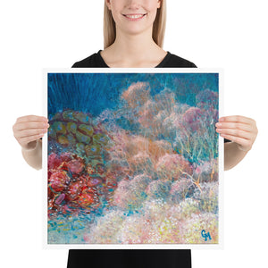 Woman holding square reef art print by Grace Marquez in 18 x 18 inches