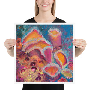 Woman holding colourful 18 by 18 inch art print with vibrant pink and orange sponges