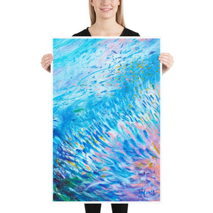 Woman holding 24 by 36 inch art print of blue, white and pink Marine Life