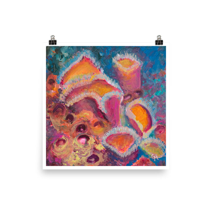 Colourful square art print with vibrant pink and orange sponges held up by two binder clips