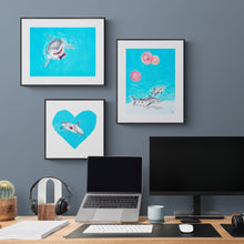 Load image into Gallery viewer, Grouping of three art prints of great white sharks in a home office with desk and laptop.