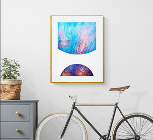 Art print called "Bubbles Jellyfish Dance" by underwater artist Grace Marquez matted and framed on the wall of a hallway with a bicycle and hall table.