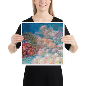 Woman holding square reef art print by Grace Marquez in 14 x 14 inches
