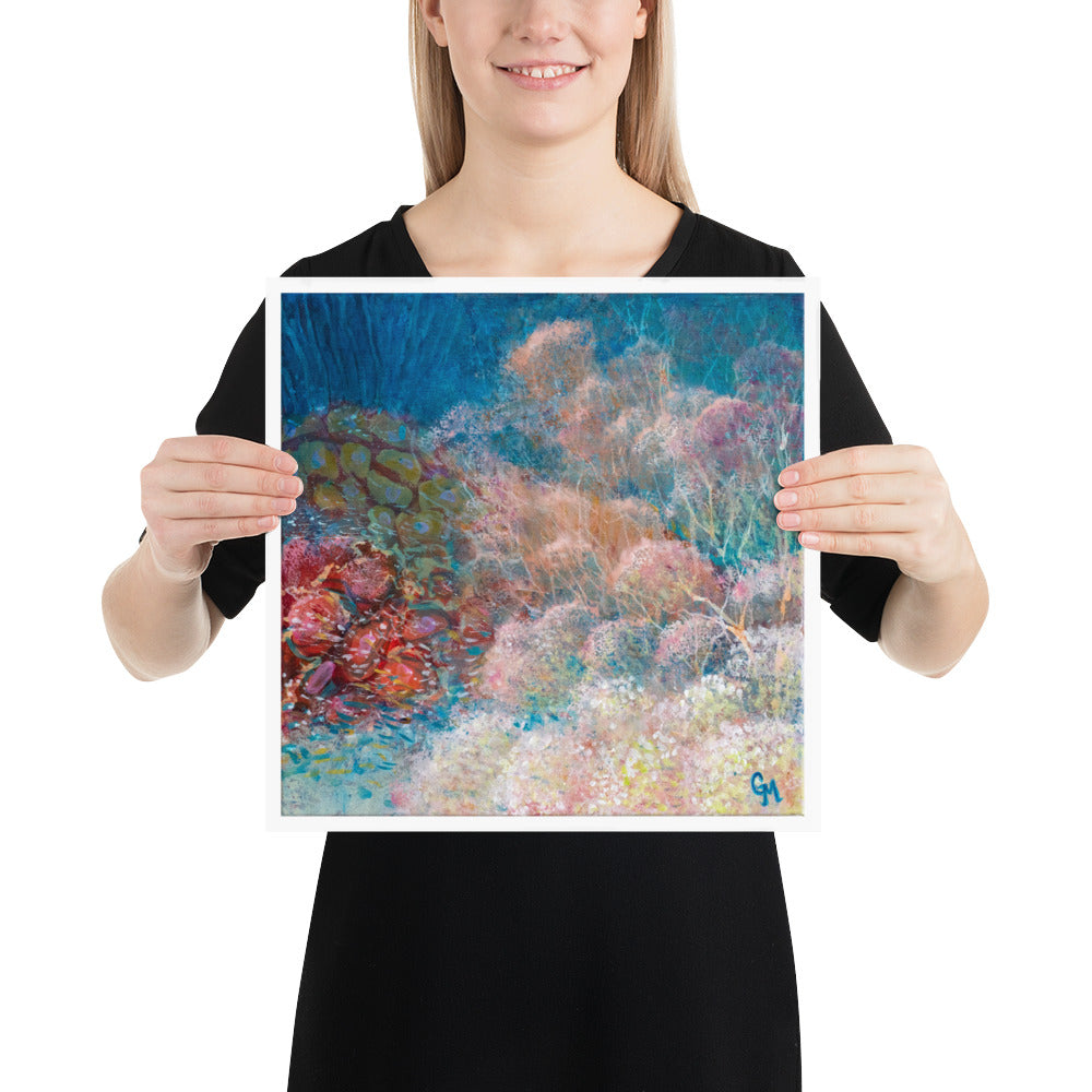 Woman holding square reef art print by Grace Marquez in 14 x 14 inches